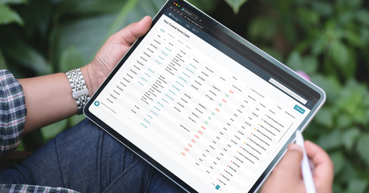 Funeral director working Parting Pro cremation arrangement software to manage cases and get more organized